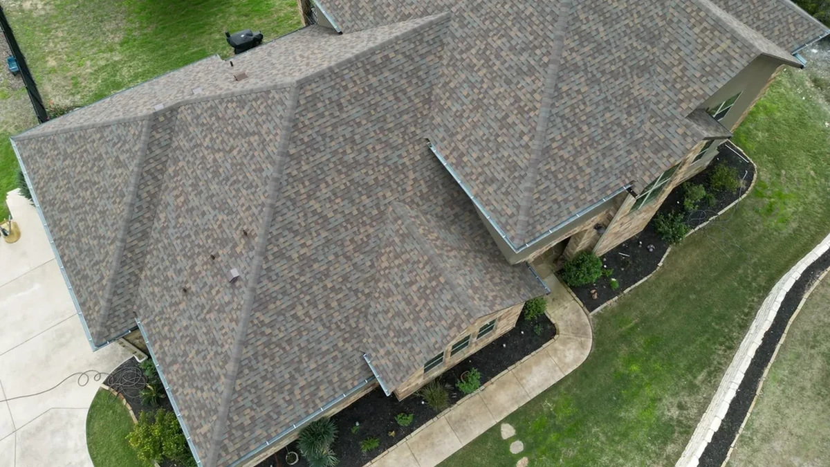 A two story home in Gastonia with a new shingle roof and clean ridge lines
